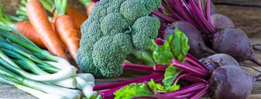 A bunch of vegetables are sitting on the table