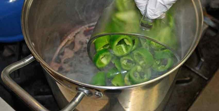 Adding jalapeños to hot brine