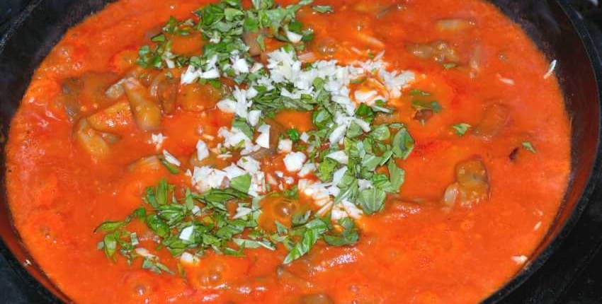 Garnishing Eggplant and Tomato Sauce