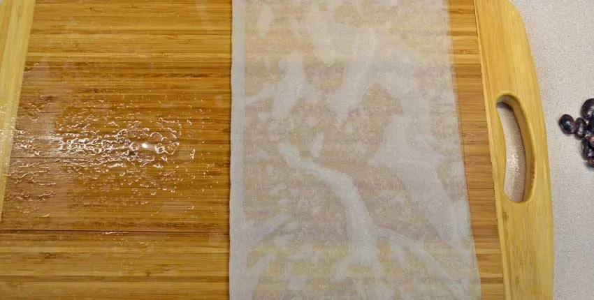 A wooden floor with some white paper on it