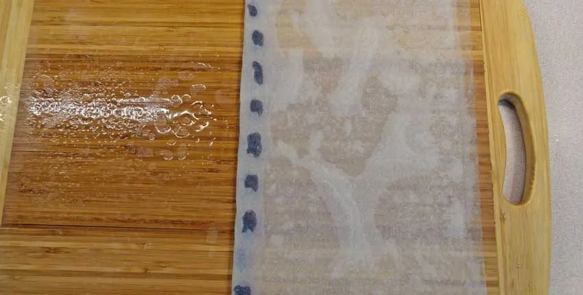 A close up of the wood floor with a blue strip