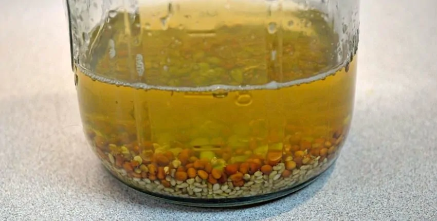 A glass bowl filled with liquid on top of a table.