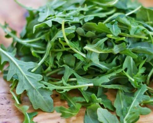 A close up of some green leaves on a plate