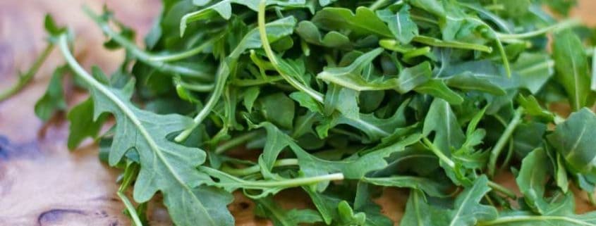 A close up of some green leaves on a plate