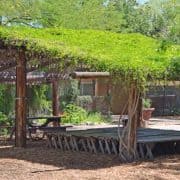 A wooden structure with grass on top of it.