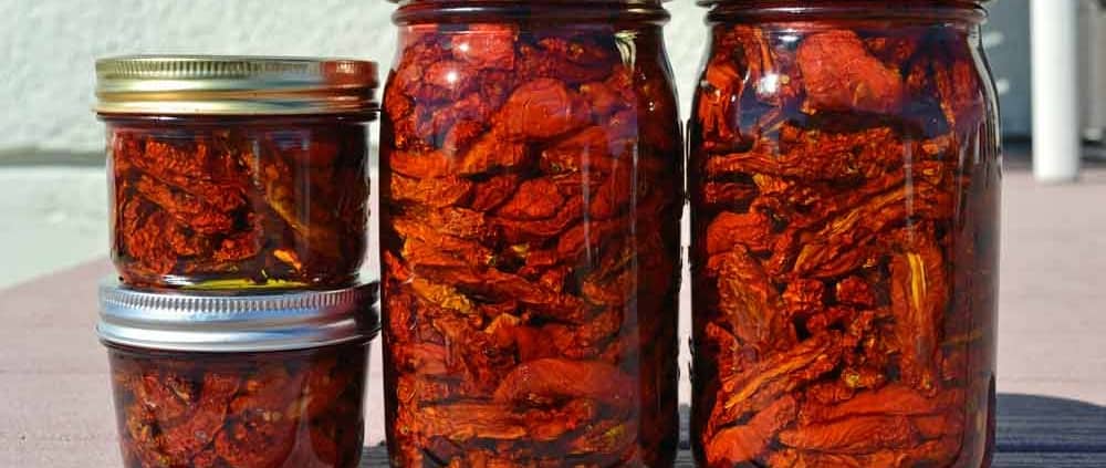 A group of jars filled with food on top of a table.