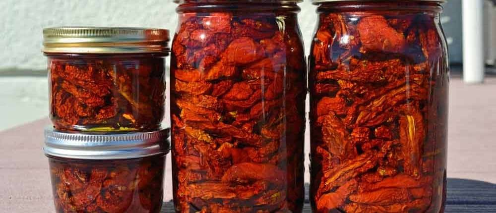 A group of jars filled with food on top of a table.