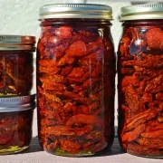A group of jars filled with food on top of a table.