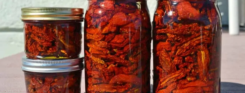 A group of jars filled with food on top of a table.