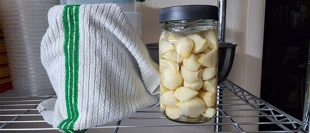 Korean pickled garlic. First brining with vinegar and salt.