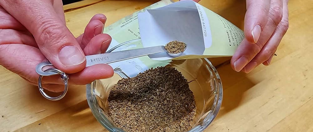 Hand Packing Seeds with Scoop