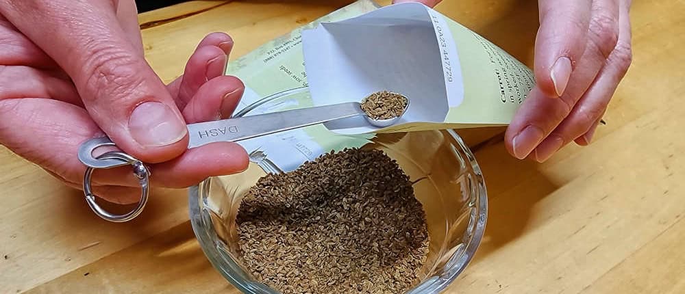 Hand Packing Seeds with Scoop