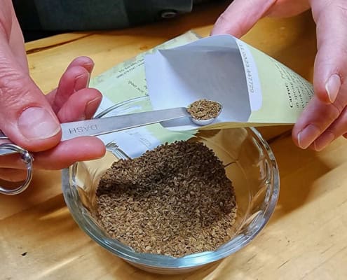 Hand Packing Seeds with Scoop
