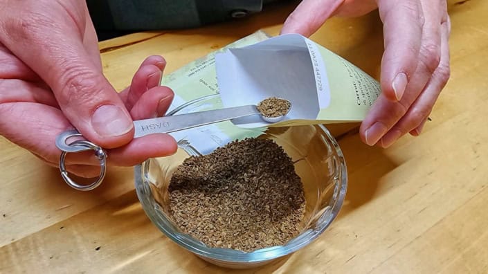 Hand Packing Seeds with Scoop