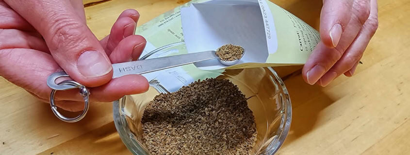 Hand Packing Seeds with Scoop